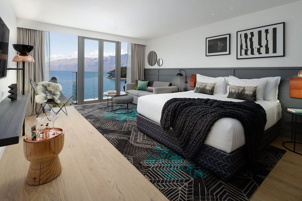 Guest room interior blending native timber, stone and soft wool textiles